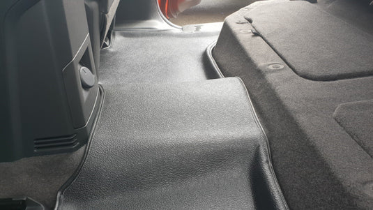 close up image of rubber floor mats in rear floor of ute