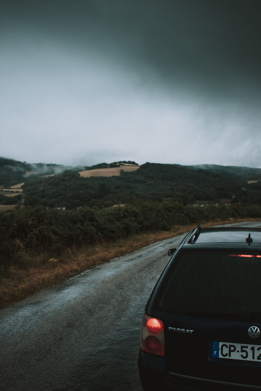 following car, headlights, cloudy day on a nz country trail