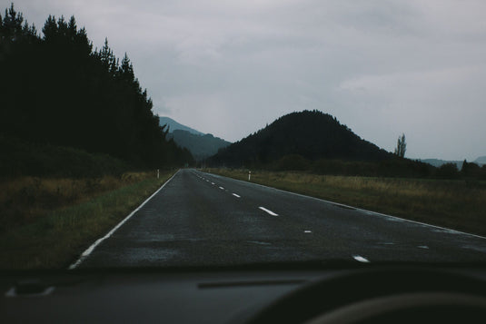 grey wintery day, ute driving down a bleak road