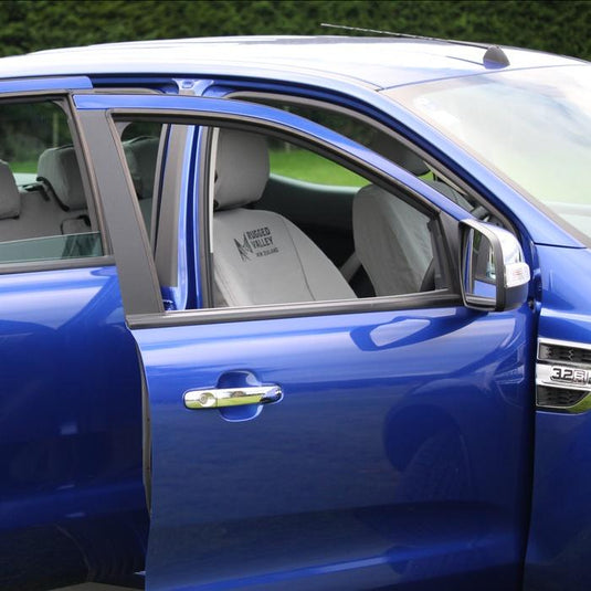 looking through blue ute window, grey rugged valley seat covers 