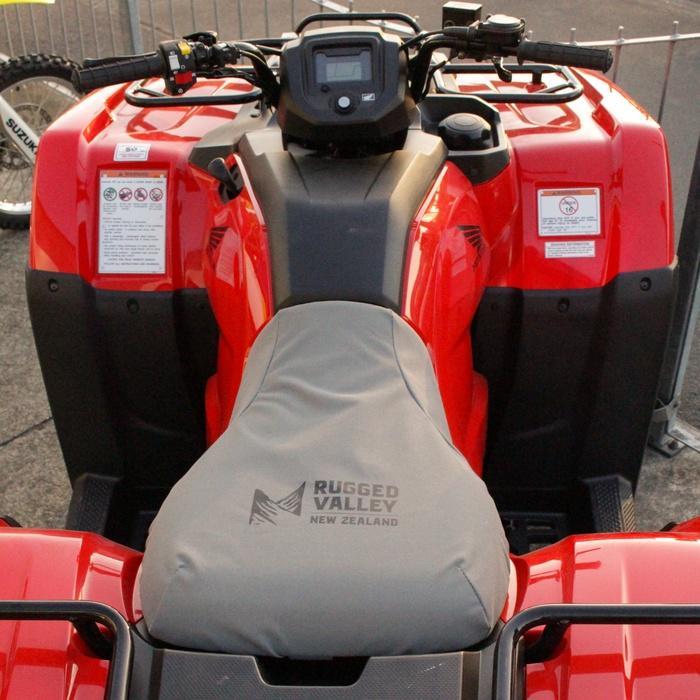 Load image into Gallery viewer, Grey Rugged Valley seat cover fitted to quad bike
