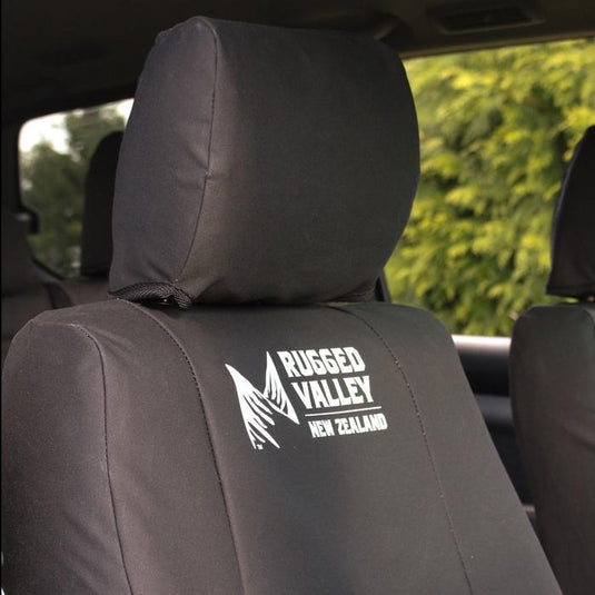 CLose up of driver seat in wagon with black rugged valley seat cover